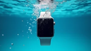 Professional underwater photography of smartwatch submerged in crystal-clear blue water with bubbles rising, showing water droplets on the device screen, photorealistic detail