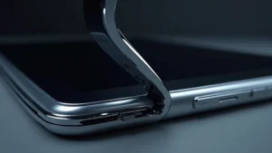 Samsung Galaxy Z Flip5 unfolded display showing foldable screen and hinge mechanism, close-up detail of crease and protective layers, professional product photography lighting